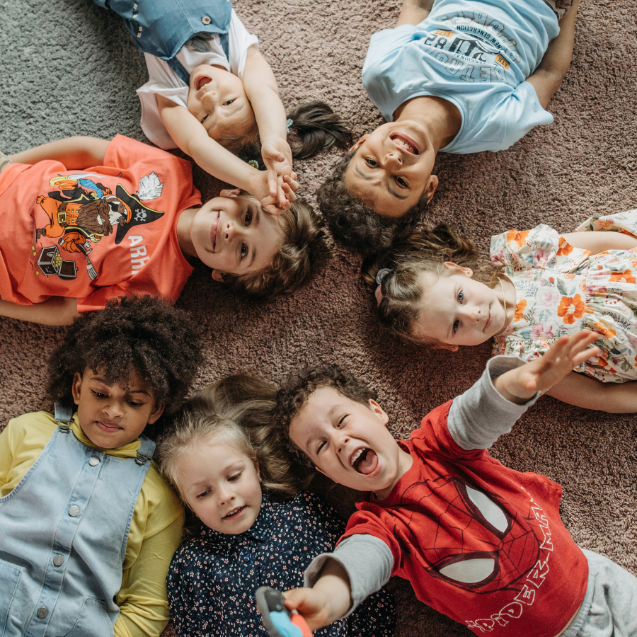 Preschool Children laying in a circle