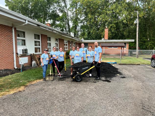 Group of people getting ready to mulch